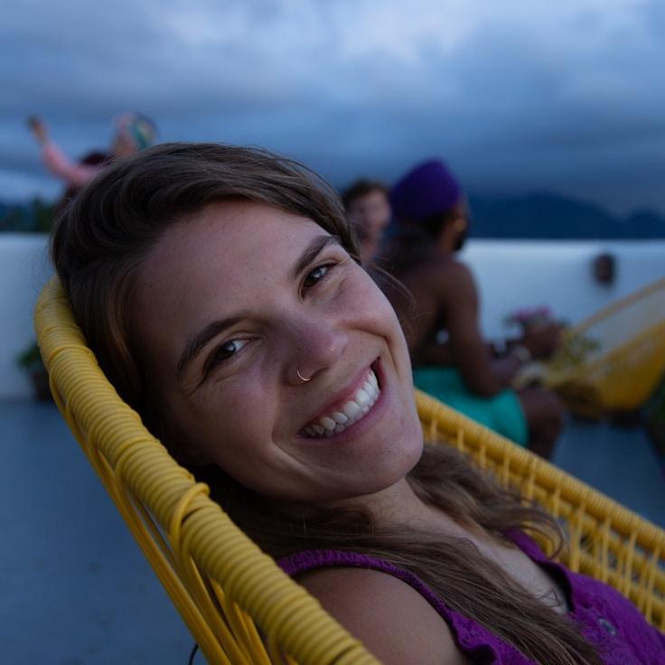 Anaya Sharma, Lead Design Curator at Crystal Ridge Box, reviewing corporate floral arrangements